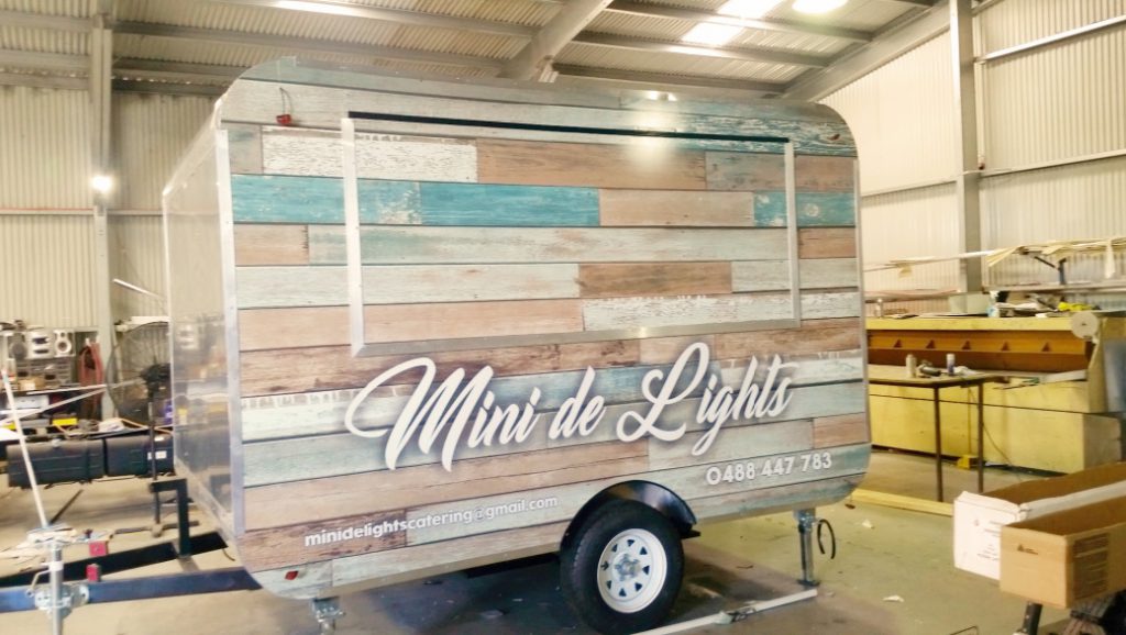 Mini de Lights Trailer, full vinyl-wrap business signage.